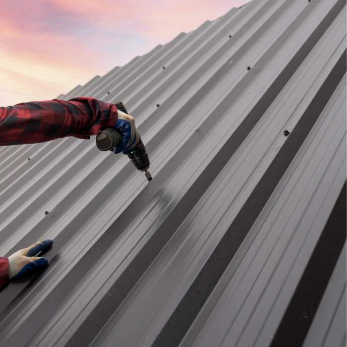 roofer installing metal sheet